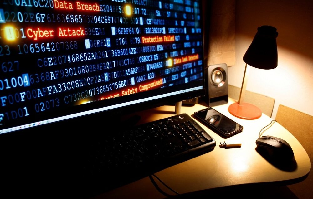 cyber-crime-cyber-attack-hacking-computer-desktop-MDCX8BS