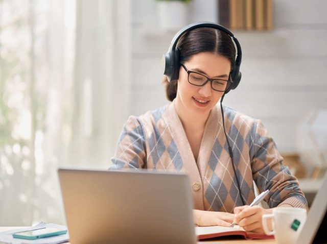 woman-working-on-a-laptop-GTBKRNM-scaled-scaled